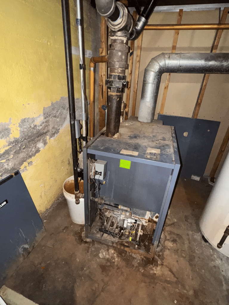 plumbers in progress repairing boiler problem