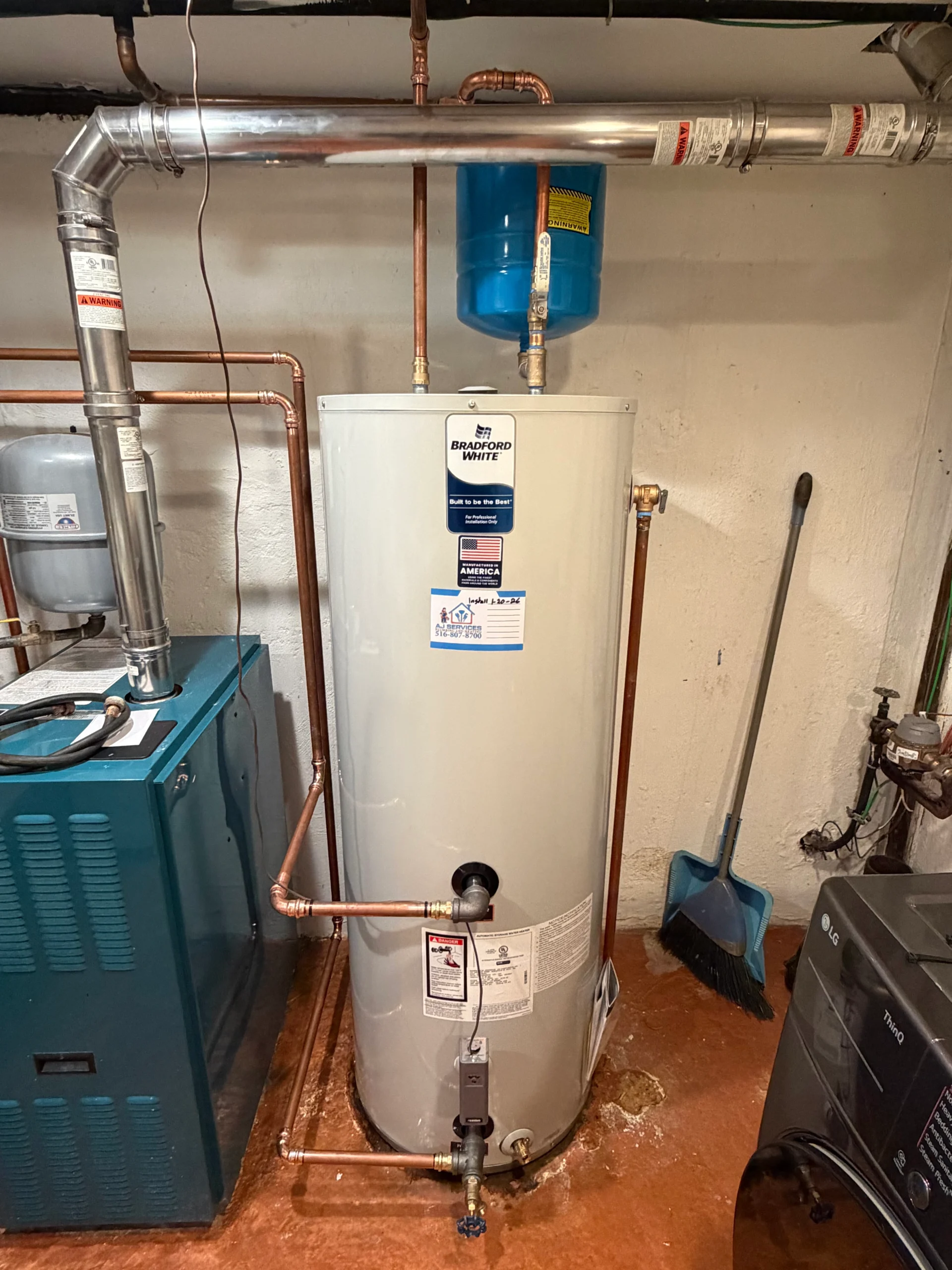 Bradford White gas water heater installation with expansion tank and code-compliant venting in Long Island home